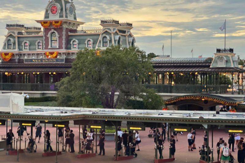 Magic Kingdom entrance from monorail Cast Members in new costumes for Mickey's Not-So-Scary Halloween Party