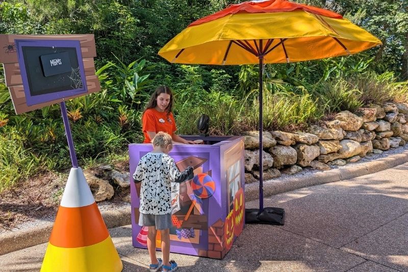 Son opening bag for candy at SeaWorld Orlando Spooktacular trick-or-treat 