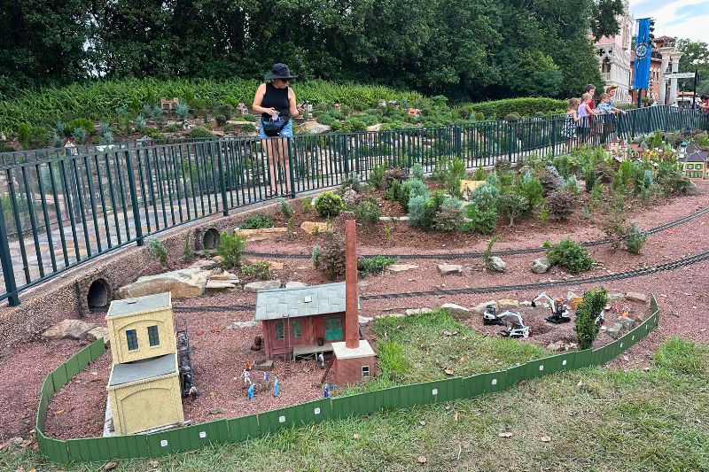 Disney construction wall scene Epcot Germany Pavilion train garden