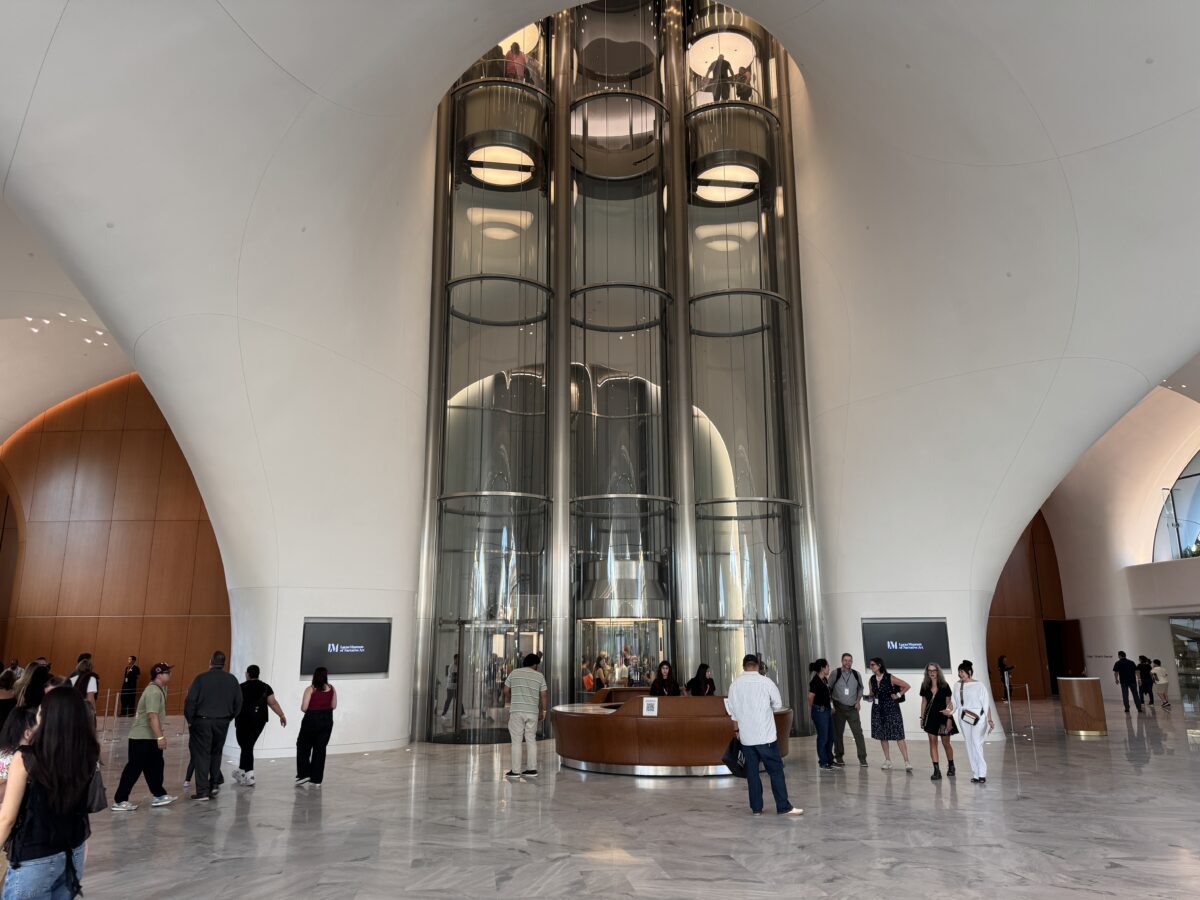 A trio of tubular elevators anchor the grand lobby of the Lucas Museum of Narrative Art