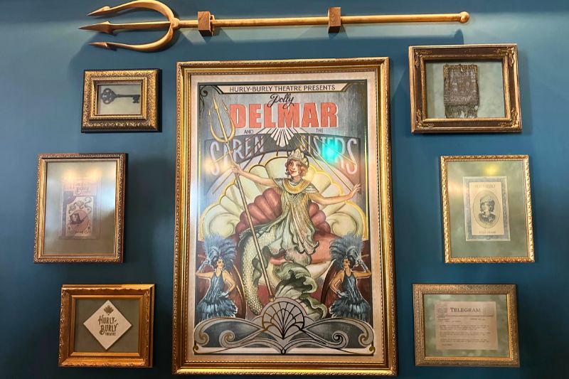 Polly Delmar Siren Sisters poster and props at Hurly-Burly 