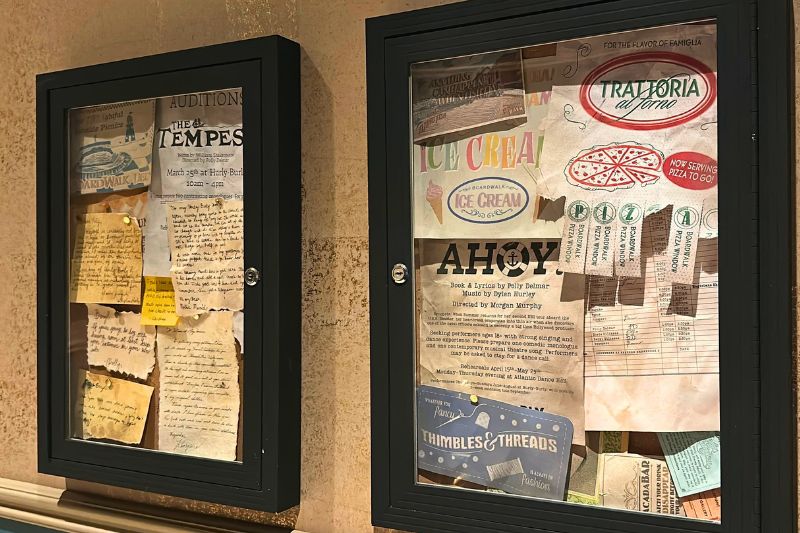 Props, letters, flyers on display at Hurly-Burly, near the restrooms.