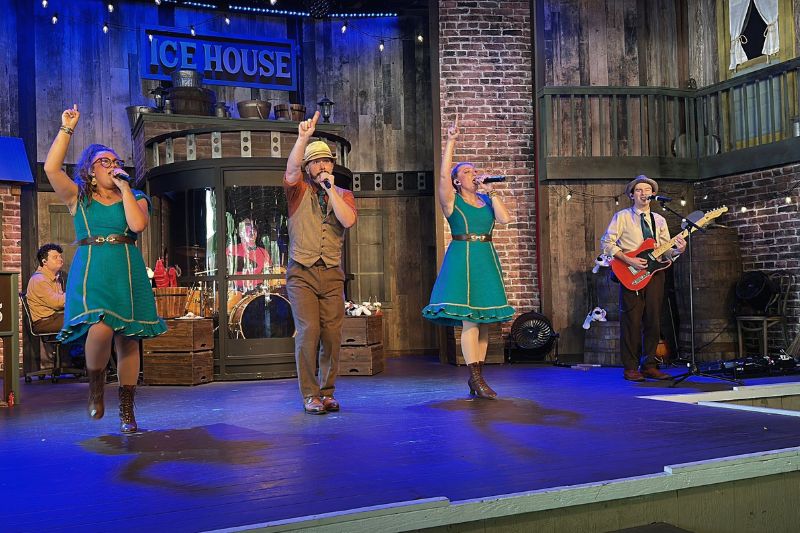 The Docksiders perform at Silver Dollar City on Ice House stage with three singers a guitarist and drummer