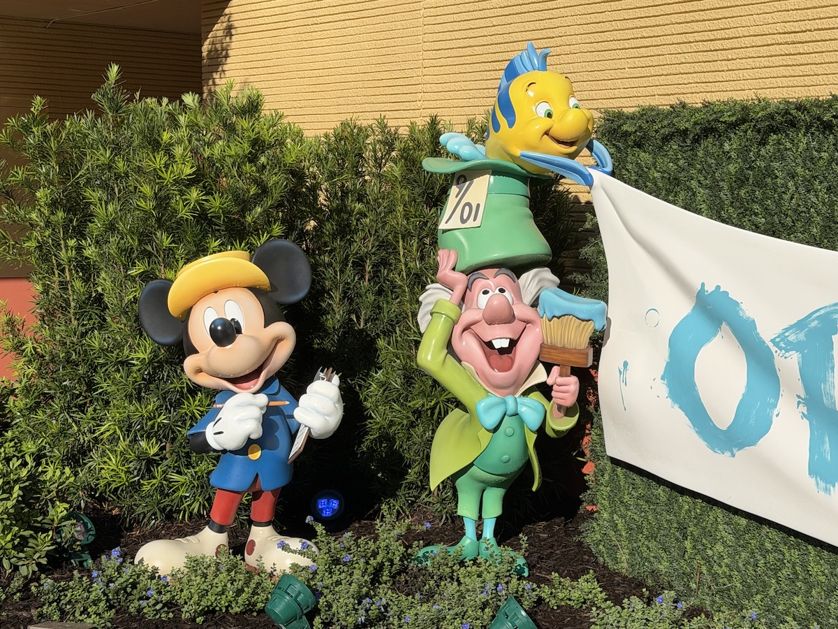 Statues of Micky Mouse, Mad Hatter, and Flounder