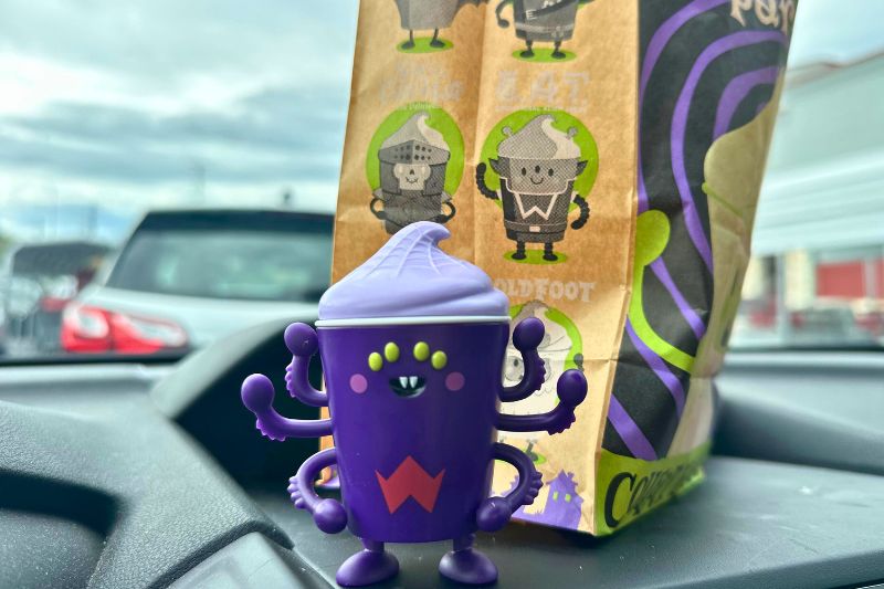 Tran Chilla Wendy's toy 2026 on a car dashboard