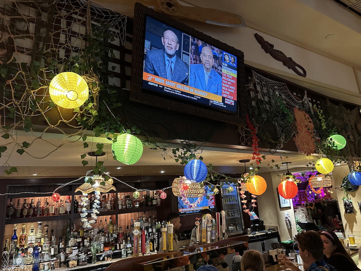 Bar decorations consisting of paper lanterns, fishing nets, flower garlands and more