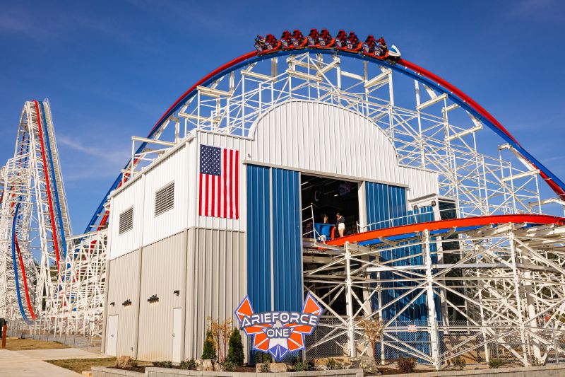 arieforce one coaster, sign, and building