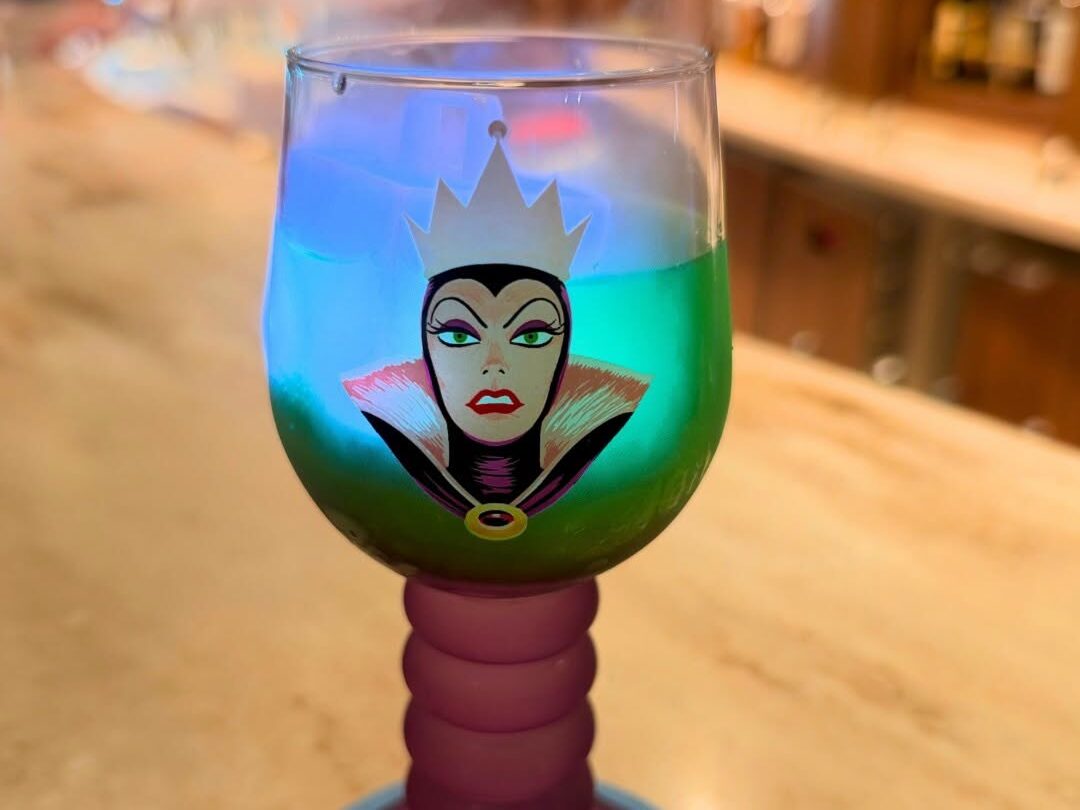 Evil Queen specialty drink aboard Disney Believe reveal cruise
