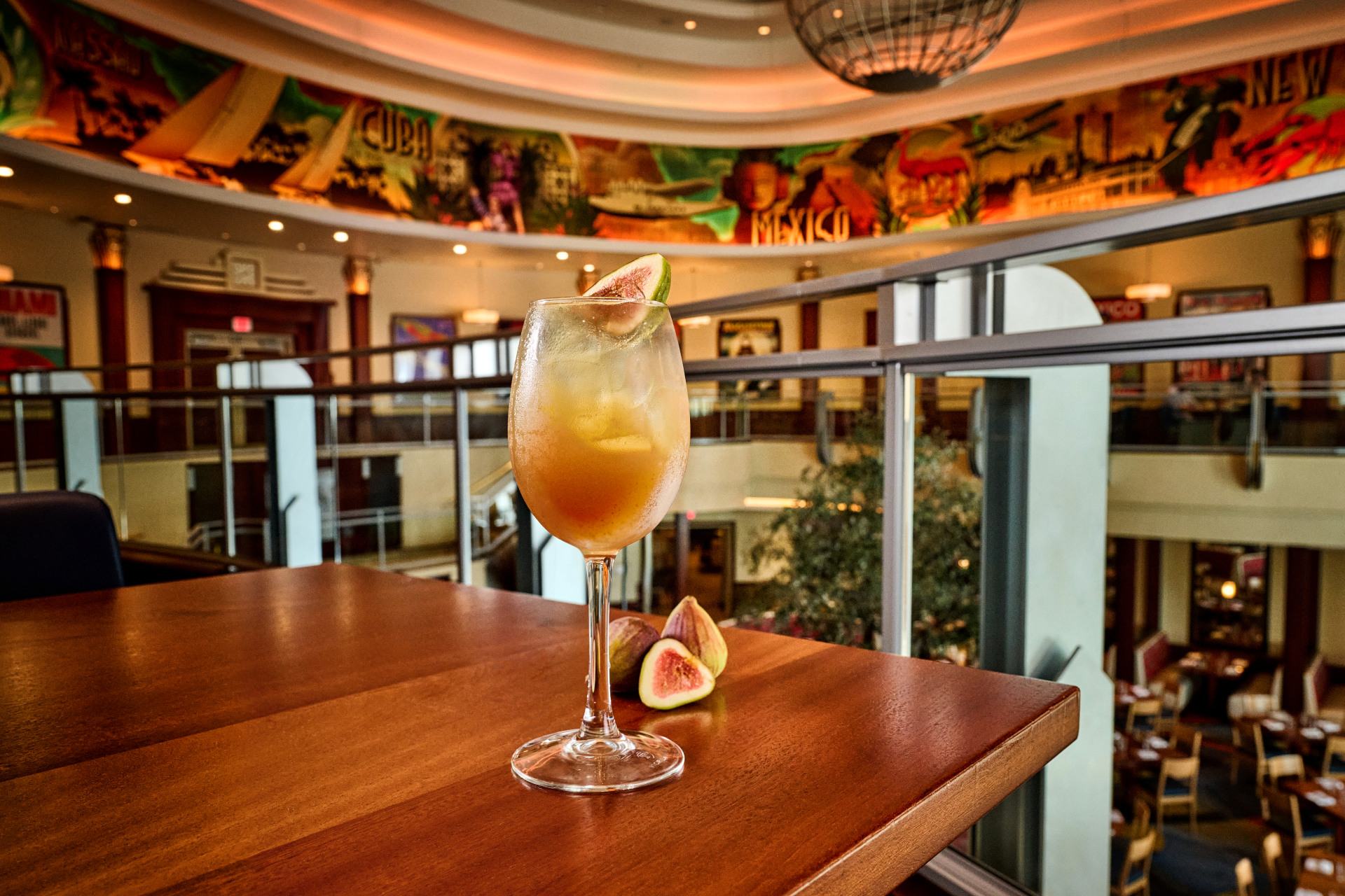 Fig Spritz beverage shown on a wooden table