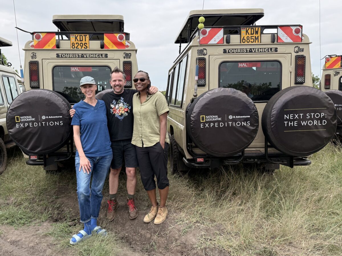 National Geographic filmmakers in front of safari vehicles
