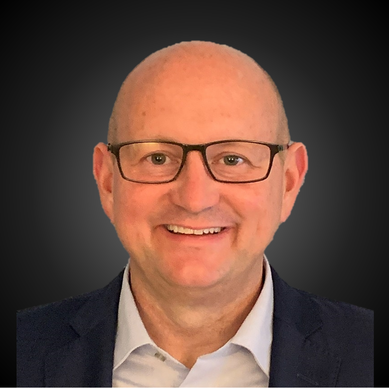headshot of John Reilly ceo of six flags
