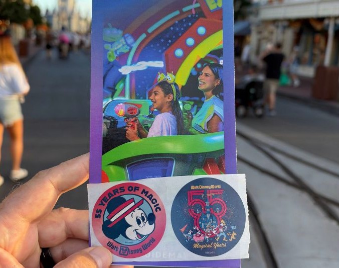 Walt Disney World 55th anniversary stickers in front of magic kingdom map