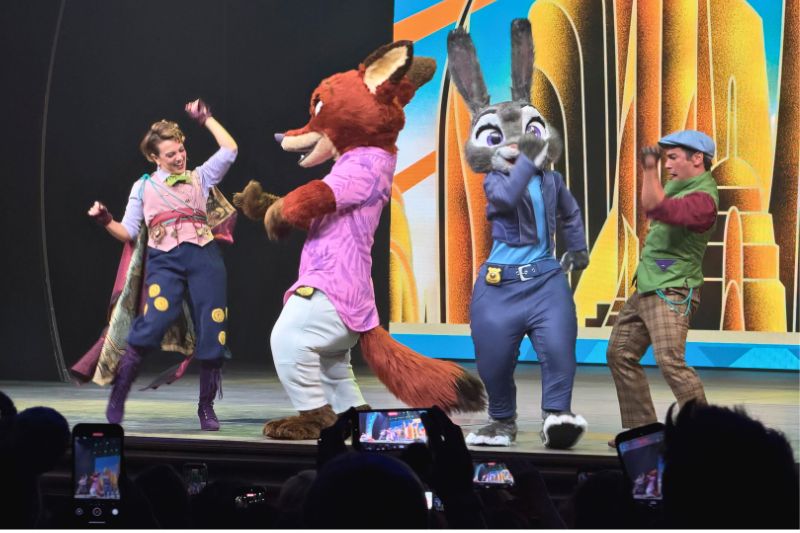 Zootopia venue announced inside Walt Disney Theater Disney Believe reveal cruise with performers and characters on stage